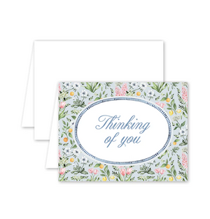 Greeting card with floral design and 'Thinking of you' text on a white background