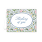 Floral card with 'Thinking of you' text on a white background