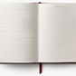 Open notebook with lined pages on a white background