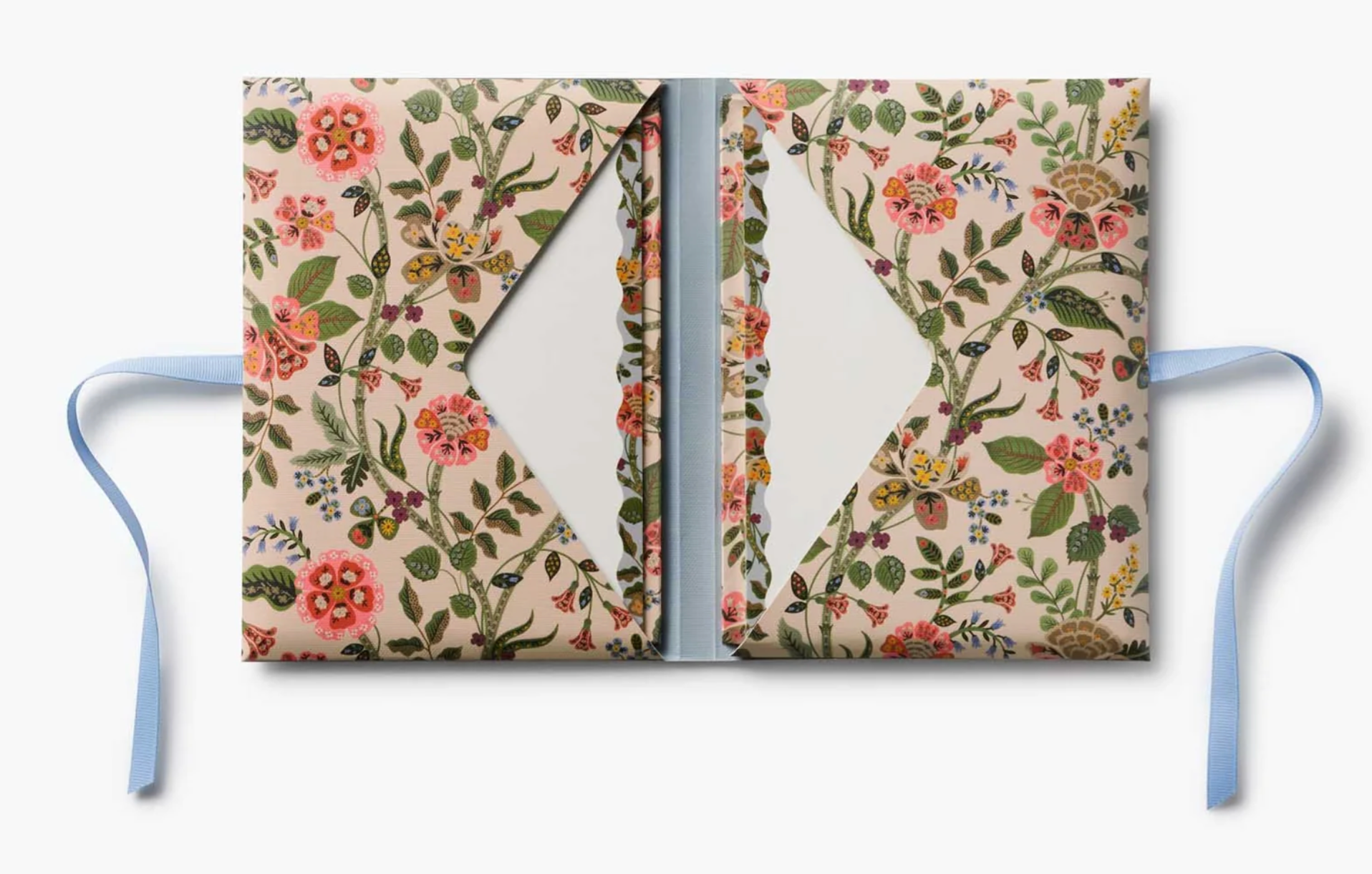 Floral-patterned notebook with a blue strap on a white background