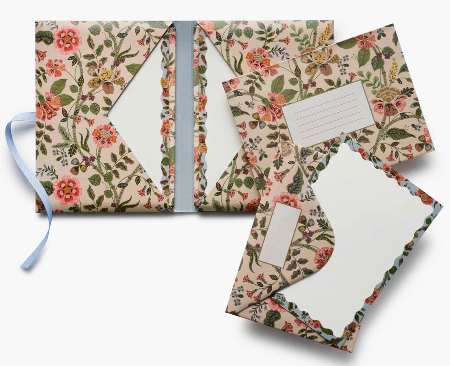 Floral patterned stationery set with envelopes and cards on a white background