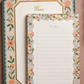Floral-themed memo pad with decorative border on a brown background