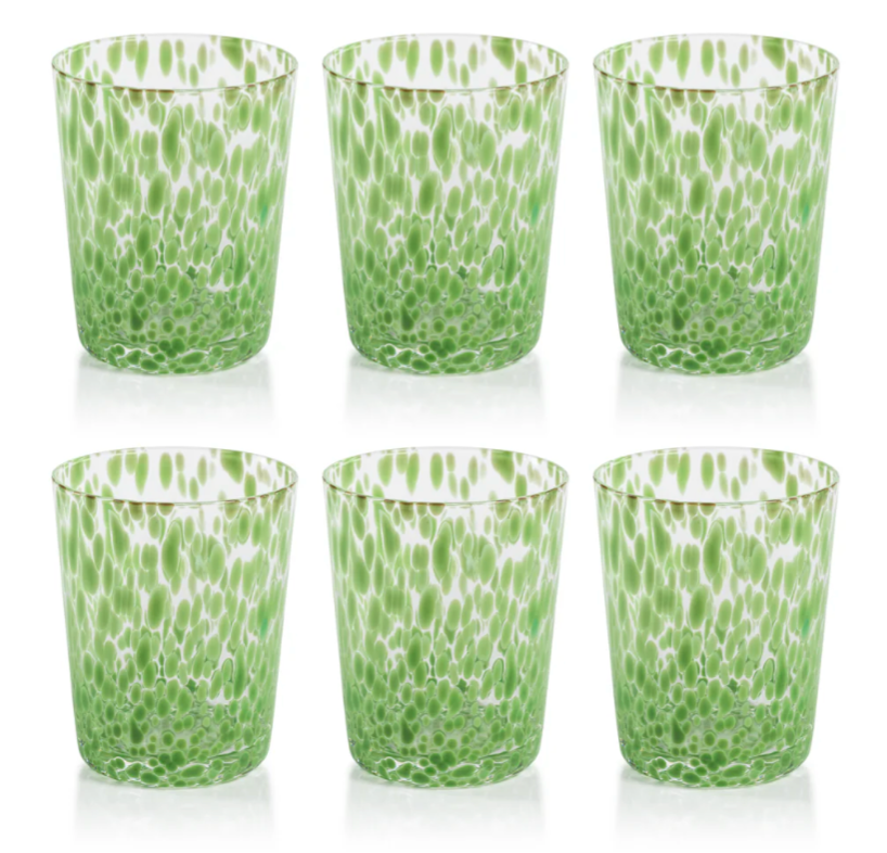 Set of six green and white patterned glass tumblers on a white background