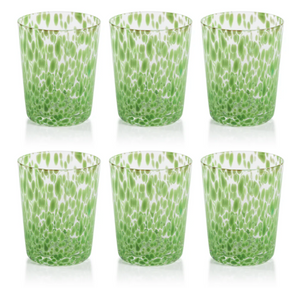 Set of six green and white patterned glass tumblers on a white background