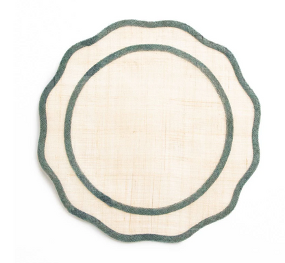 Round woven placemat with green border on a white background
