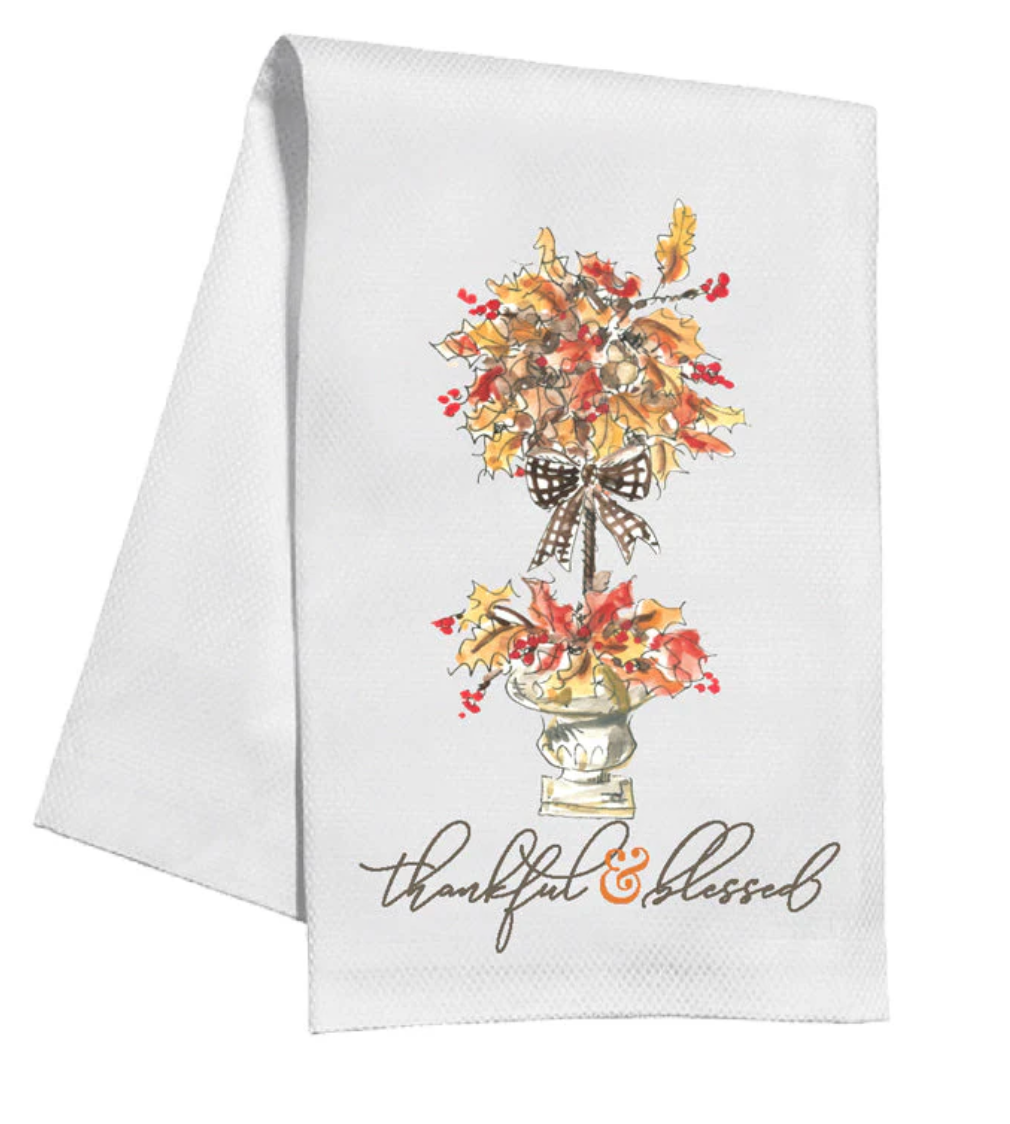 White towel with autumn-themed design and 'thankful & blessed' text on a white background