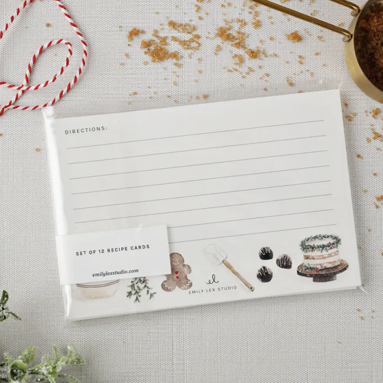 Set of recipe cards with decorative elements on a textured surface.