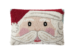 Decorative pillow with a face design on a white background