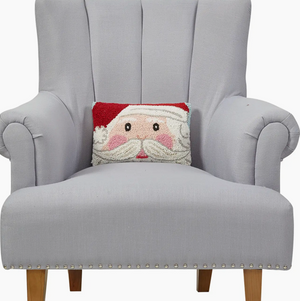 Gray armchair with a Santa Claus pillow on a white background