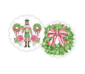 Two Christmas-themed decorative items: a nutcracker and a wreath with a bow, on a white background.