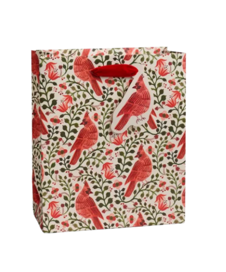 Gift bag with red cardinal bird and floral pattern on a white background