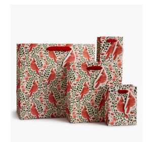 Set of three bags with red and green pattern on a white background