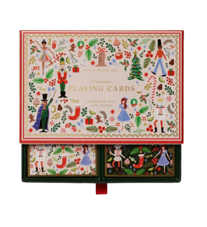 Christmas-themed playing card box with festive illustrations on a white background