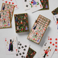 Playing cards with festive designs on a white background