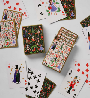 Playing cards with festive designs on a white background