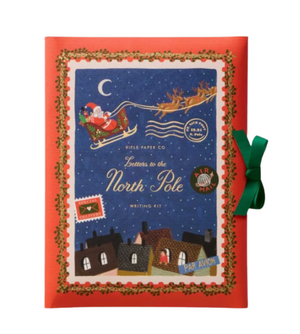 Christmas-themed writing kit with Santa Claus and reindeer on a blue background, framed by holly leaves and a green bow.