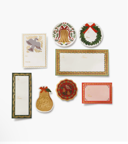 Set of Christmas-themed stationery items including cards and place mats on a white background.