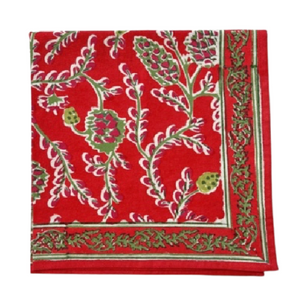 Red fabric with green and white floral pattern on a white background