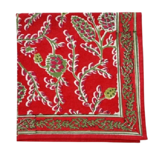 Red fabric with green and white floral pattern on a white background