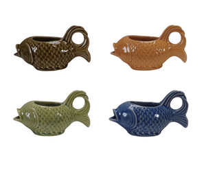 Four ceramic fish-shaped planters in different colors on a white background