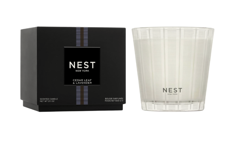 NEST candle and packaging on a white background