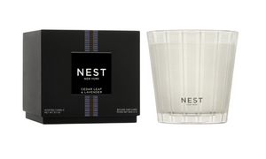 NEST candle and packaging on a white background
