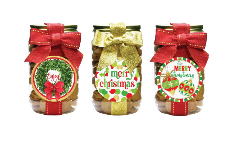 Three jars with Christmas-themed labels and ribbons on a white background