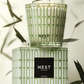 NEST New York candle and packaging with leafy background