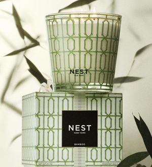 NEST New York candle and packaging with leafy background