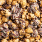 Assorted popcorn with chocolate drizzle and sprinkles in a close-up shot