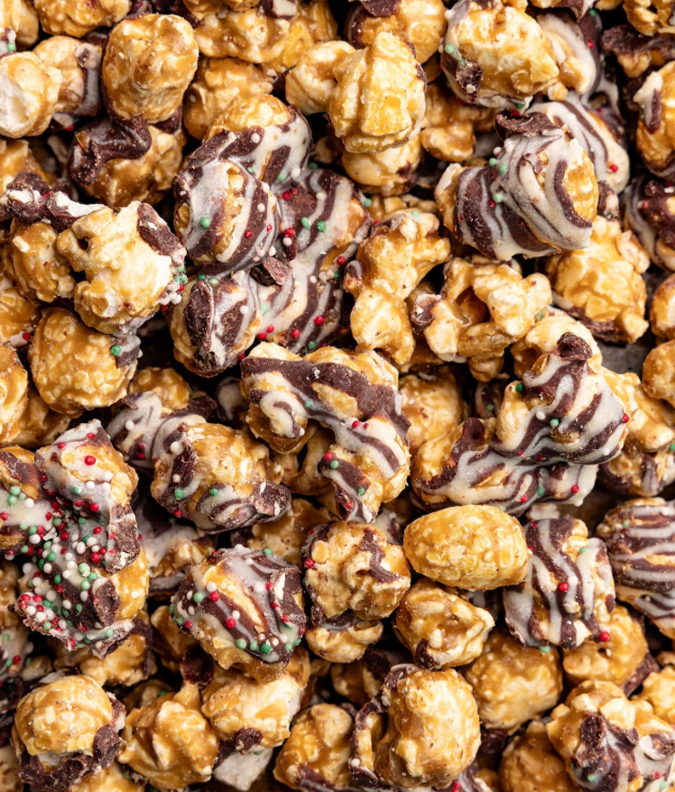 Assorted popcorn with chocolate drizzle and sprinkles in a close-up shot
