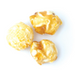 Three pieces of popcorn on a white background