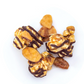 Caramel corn with chocolate drizzle on a white background