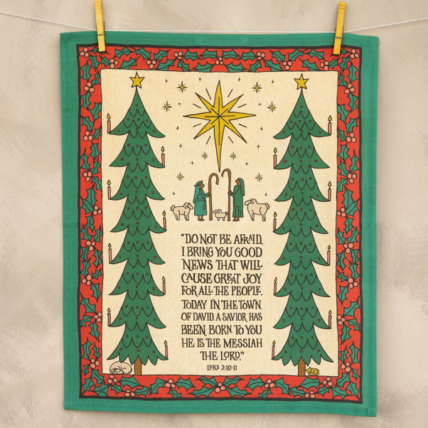 Decorative panel with Christmas trees, star, and nativity scene on a beige background