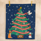 Decorative Christmas tree towel with festive design on a beige background