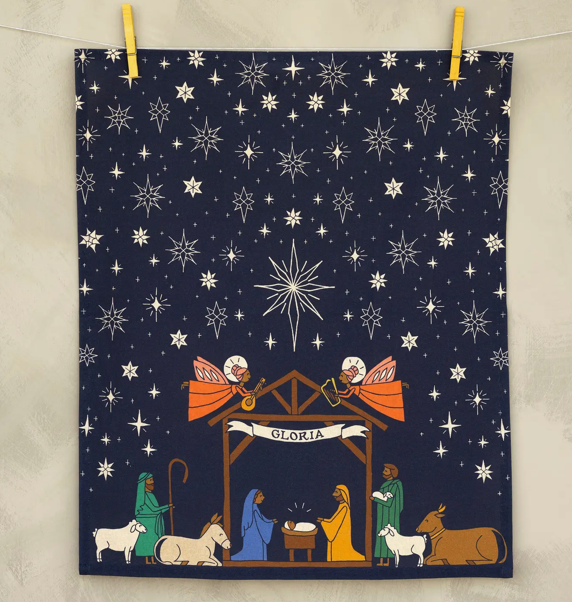 Nativity scene with angels and stars on a dark blue background, hanging on a line.
