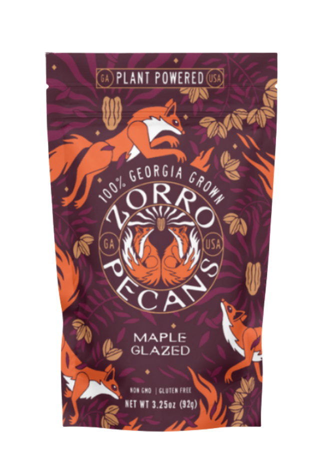 Zorro Pecans maple glazed pecans packaging with fox illustrations on a purple background